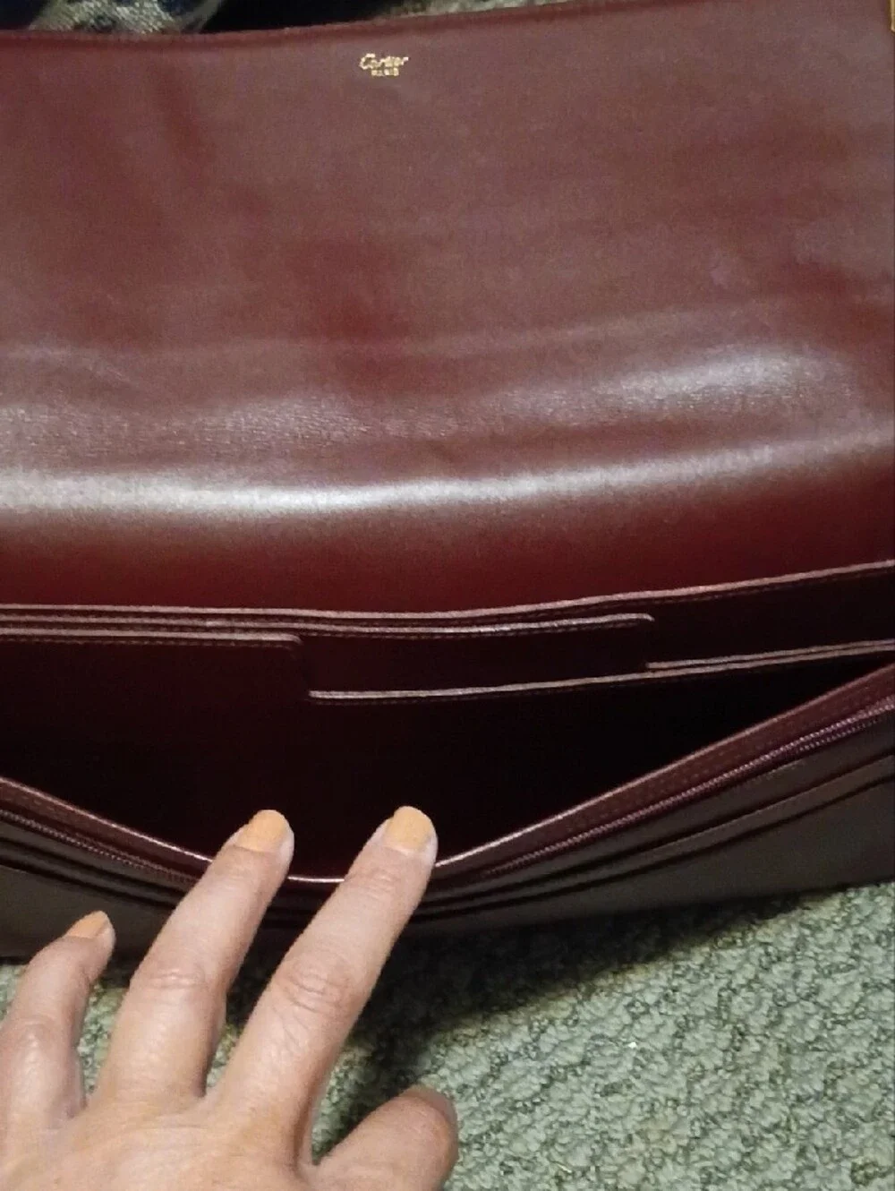Cartier- Leather Fold-Over Clutch in Burgundy with Gold Accents